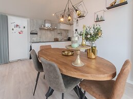 Modern Chalet on the Water at a Holiday Park