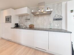 Modern Chalet on the Water at a Holiday Park