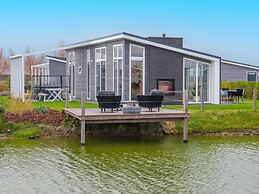 Modern Chalet on the Water at a Holiday Park