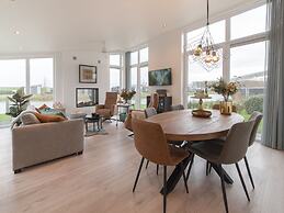 Modern Chalet on the Water at a Holiday Park