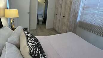 Nestled in the Heart of Fitts Village, Zinnia Becons With the Promise 