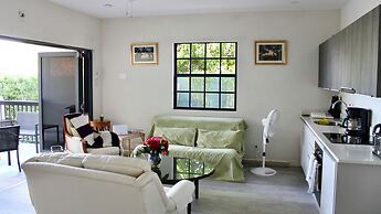 Nestled in the Heart of Fitts Village, Zinnia Becons With the Promise 