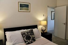 Nestled in the Heart of Fitts Village, Zinnia Becons With the Promise 