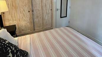 Nestled in the Heart of Fitts Village, Zinnia Becons With the Promise 