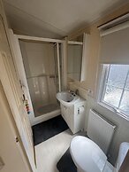 Cozy Cabin Retreat in Towyn