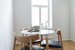 A bright wooden studio for four