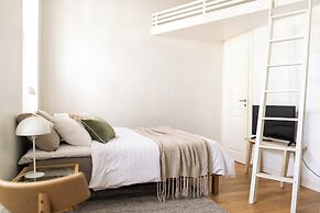 A bright wooden studio for four