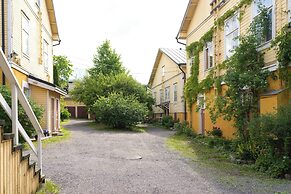 A bright wooden studio for four