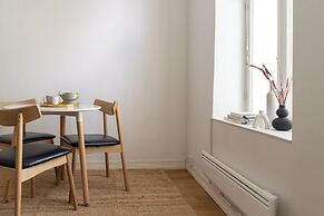 A bright wooden studio for four