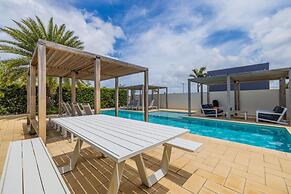 Serene Designer Gem Walk to Beach Strip Pool