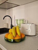 Moderno Bilocale con Terrazzo e Parcheggio