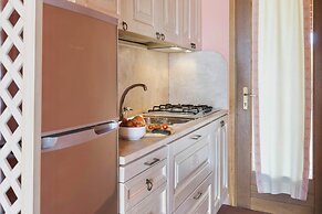 Residence with private beach in Bosa Marina