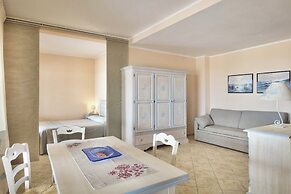 Residence with private beach in Bosa Marina