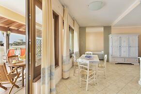 Residence with private beach in Bosa Marina