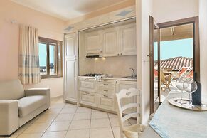 Residence with private beach in Bosa Marina