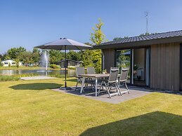 Modern Chalet on the Pond in a Holiday Park