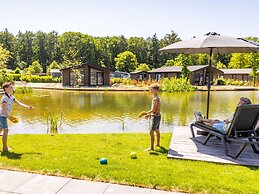 Modern Chalet on the Pond in a Holiday Park