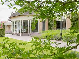 Modern Chalet on the Pond in a Holiday Park