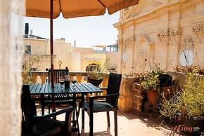 A Pretty Duplex Apartment in a Gozo Village Square