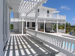 Caribbean Cliffside: Private Waterfront Retreat