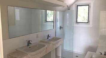 Oceanfront Haven: Elegant Estate With Private Deck