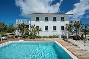 Tropical Haven: Luxurious Home Steps From Beach