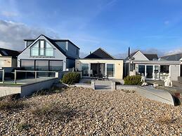 Contemporary Beachfront Bungalow With Direct Access to the Sea