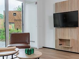 Modern Lodge With Dishwasher, on a Holiday Park in a Green Environment