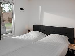 Modern Lodge With Dishwasher, on a Holiday Park in a Green Environment