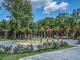 Modern Lodge With Dishwasher, on a Holiday Park in a Green Environment