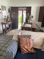 Quarto na praia com cama de casal