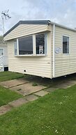 Lovely Caravan Located in an Amazing Holiday Park