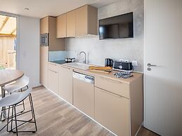 Modern Chalet With air Conditioning, in a Holiday Park, the Beach at 1