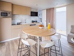 Modern Chalet With air Conditioning, in a Holiday Park, the Beach at 1