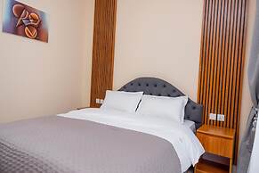 Q-Plus Apartments