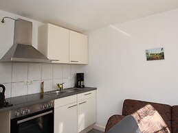 Apartment With a High Chair and bed