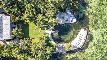 Lush Tropical Plantings In A Gated Compound Located Directly On The Fl