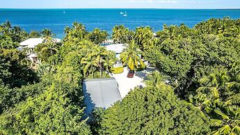 Lush Tropical Plantings In A Gated Compound Located Directly On The Fl