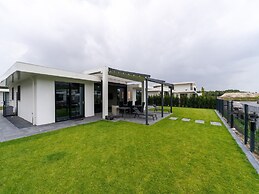 Villa With Covered Terrace and Jetty on the Water