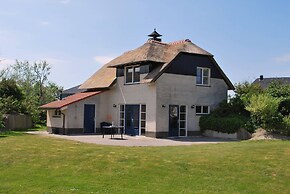 Thatched Villa With Bath in a Holiday Park