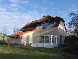Thatched Villa With Bath in a Holiday Park