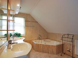 Thatched Villa With Bath in a Holiday Park
