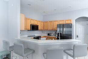 Poolside Serenity Near Disney World 4 Bedroom Home by RedAwning