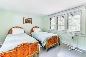 Torch Lake Getaway w/ Private Beach + Boat Dock!