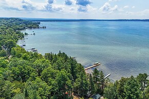 Torch Lake Getaway w/ Private Beach + Boat Dock!