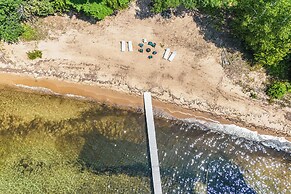 Torch Lake Getaway w/ Private Beach + Boat Dock!
