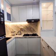 Modern And Comfortable Living At 2Br Grand Sungkono Lagoon Apartment