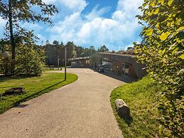 Lake House in Forest by Belvilla
