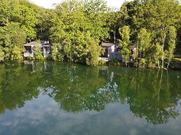 Lake House in Forest by Belvilla