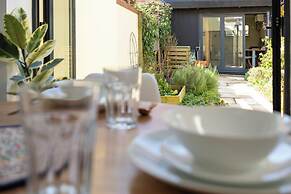 Stylish 2BD with Private Garden & Sauna